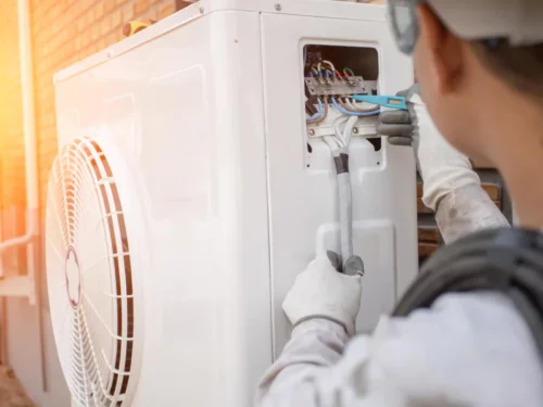 close up of a hvac contractor repairing an air conditioner goldsboro nc